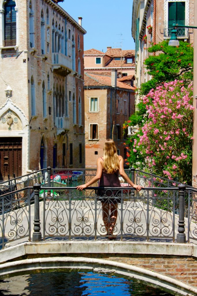 Maddy standing on a bridge in Venice