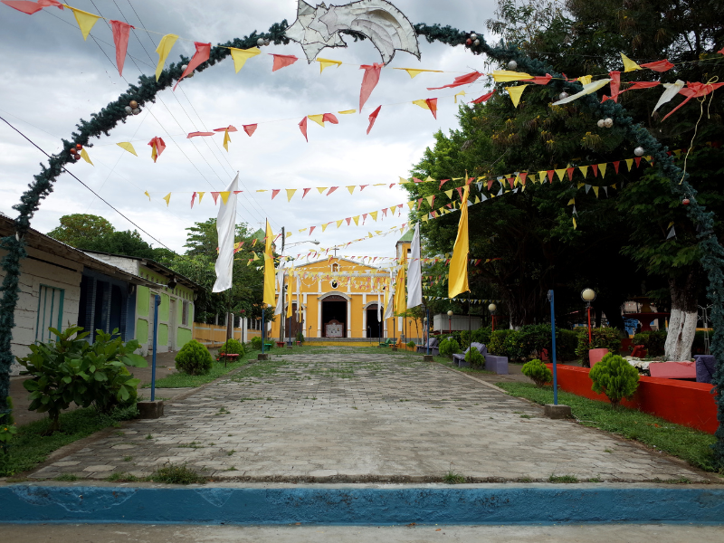 Cobblestone path leading to a church in Moyogalpa