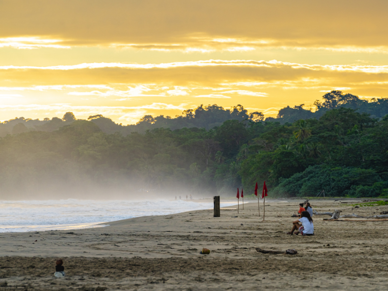 People hanging out on a beach in Puerto Viejo de Talamanca in Costa Rica