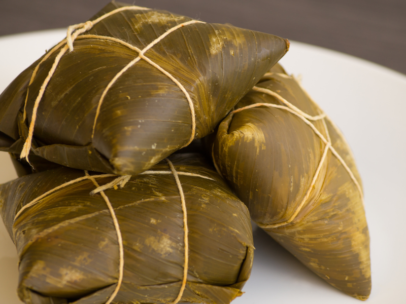 Traditional Belizean food - tamales in banana leaf